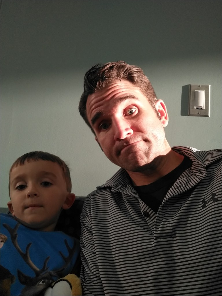 Father and son waiting at urgent care